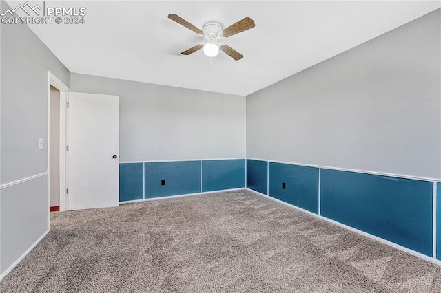 carpeted empty room with ceiling fan