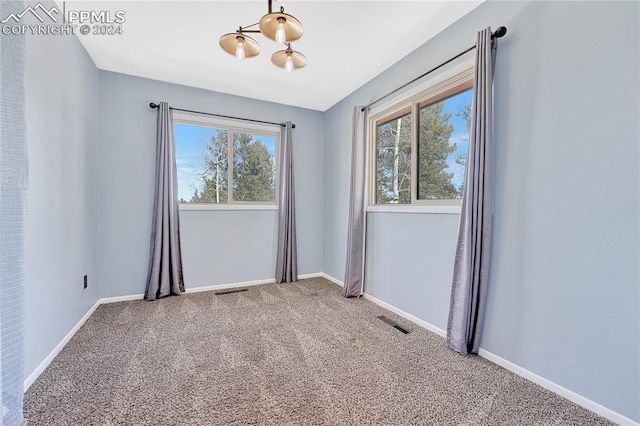 unfurnished room featuring carpet floors