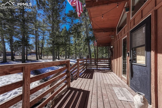 view of snow covered deck