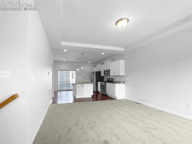 unfurnished living room featuring dark hardwood / wood-style floors and sink