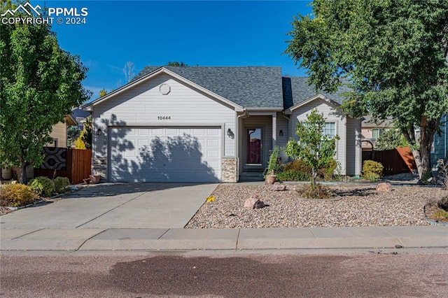 ranch-style home featuring a garage