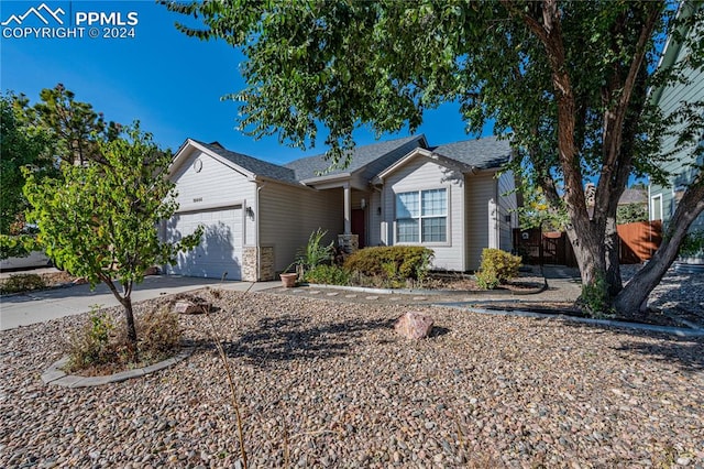 ranch-style home featuring a garage