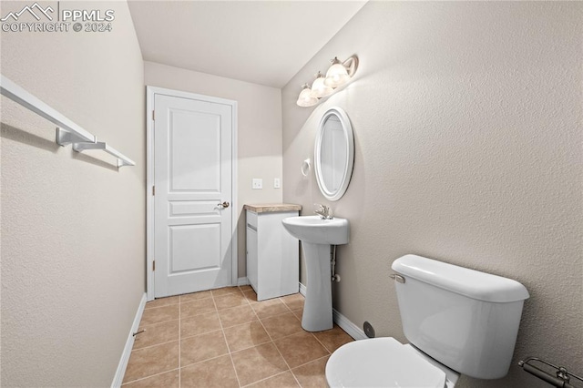 bathroom featuring tile patterned floors and toilet