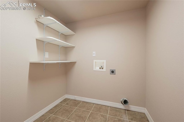 laundry room featuring hookup for a washing machine, electric dryer hookup, and tile patterned floors