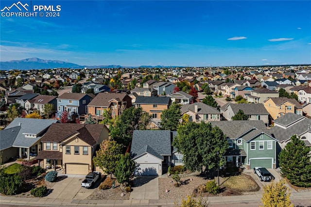 birds eye view of property with a mountain view