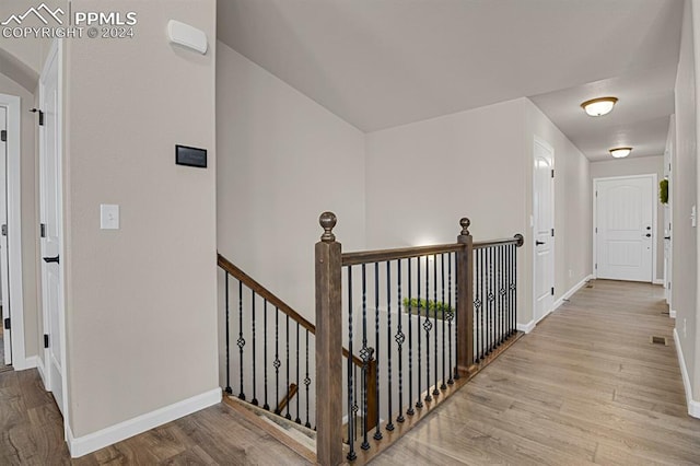 hall with light wood-type flooring