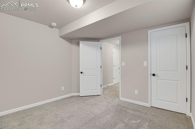 interior space featuring light colored carpet