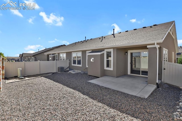 back of house with central AC and a patio area