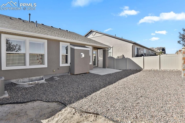 back of property featuring a patio and central AC unit