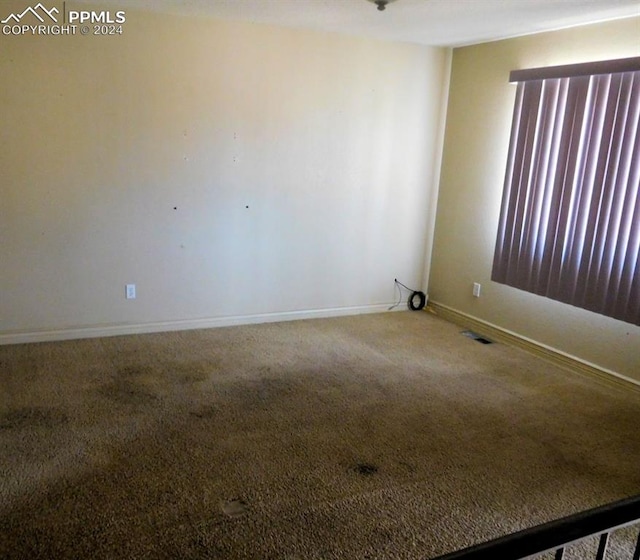 view of carpeted spare room