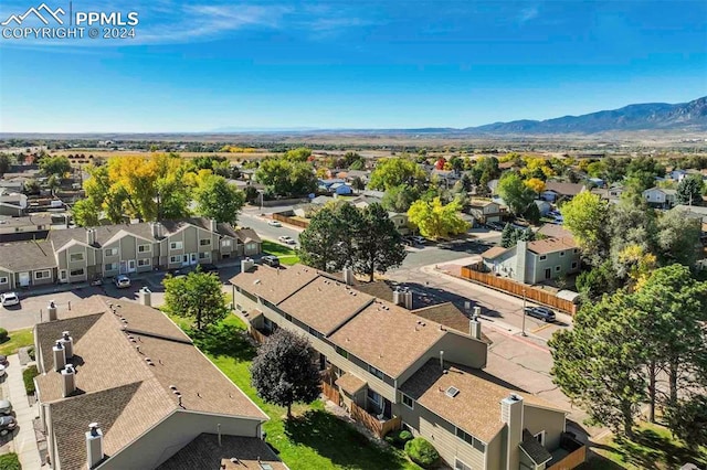 birds eye view of property featuring a mountain view