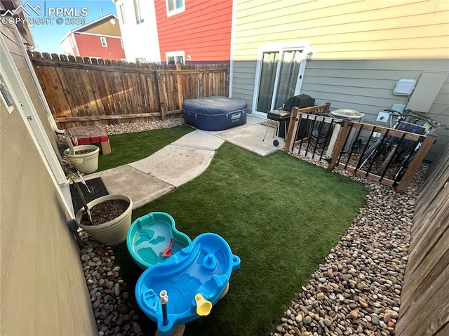 view of yard featuring a patio and a fenced backyard