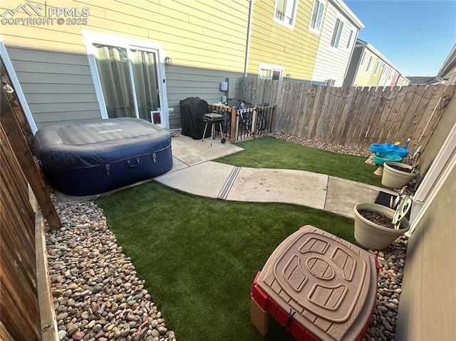 view of yard with a fenced backyard and a patio