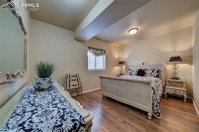 bedroom with wood-type flooring