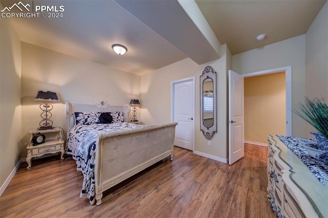 bedroom with wood-type flooring