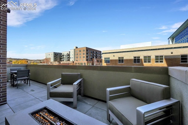 view of patio featuring an outdoor fire pit