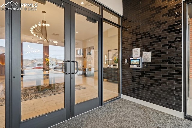 doorway featuring carpet flooring and french doors