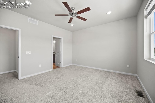 unfurnished bedroom with ceiling fan and carpet flooring