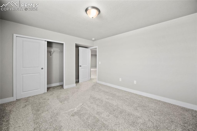 unfurnished bedroom featuring carpet flooring