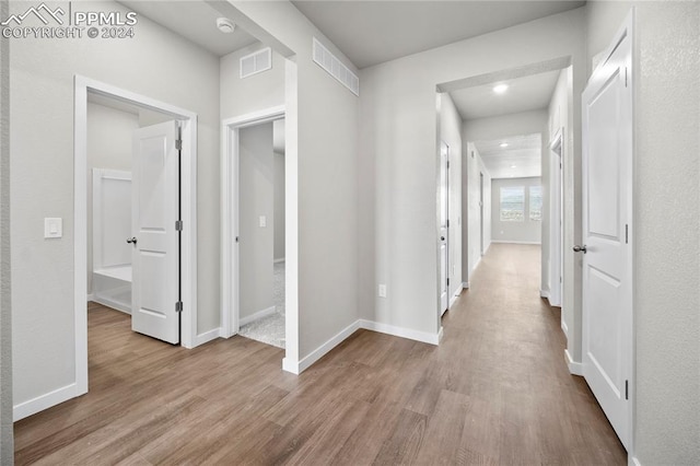 hallway featuring light hardwood / wood-style flooring