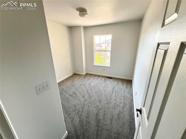 unfurnished room featuring carpet floors