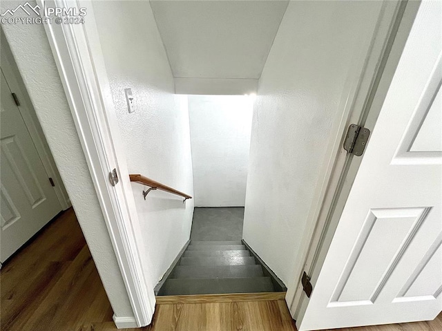 stairway featuring hardwood / wood-style floors