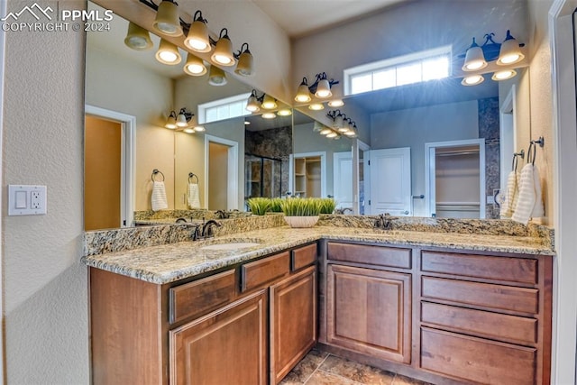 bathroom featuring vanity and a shower with shower door