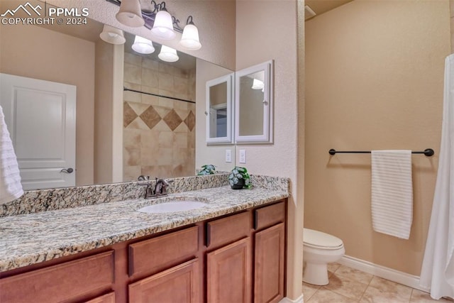 bathroom with vanity, toilet, tile patterned flooring, and a shower with shower curtain