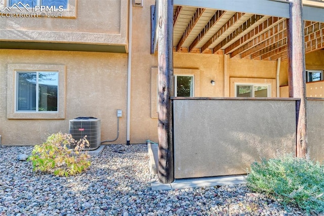 view of home's exterior with cooling unit