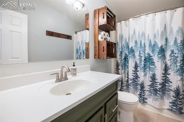 bathroom with vanity, tile patterned flooring, toilet, and curtained shower