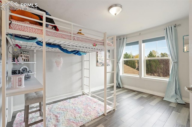 bedroom featuring wood-type flooring