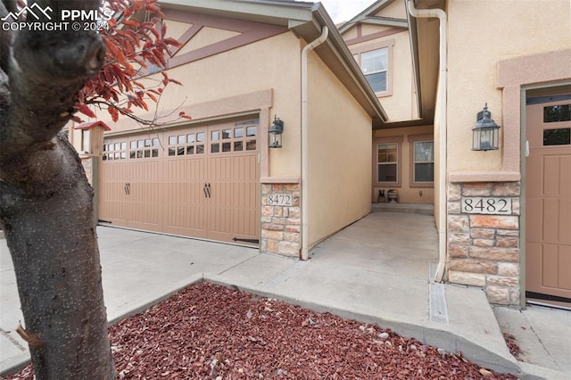 view of exterior entry featuring a garage