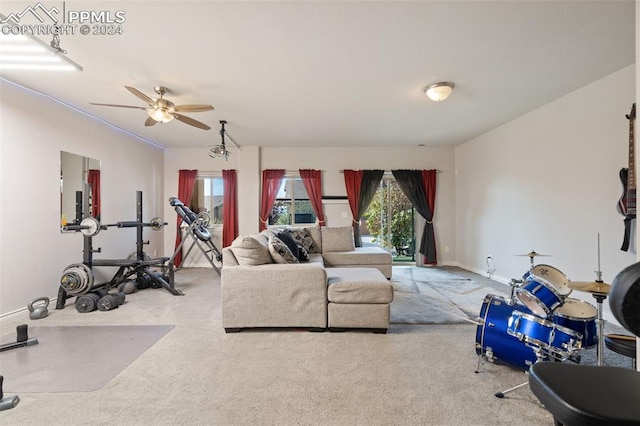 living room featuring ceiling fan and carpet