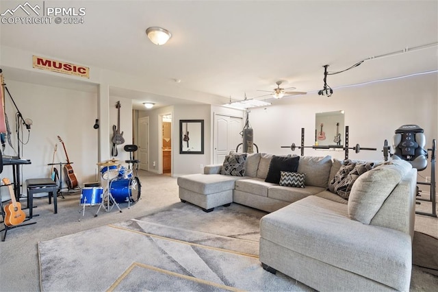 carpeted living room with ceiling fan