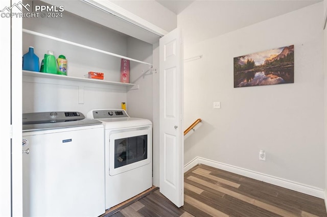 washroom featuring dark wood-type flooring and washer and clothes dryer