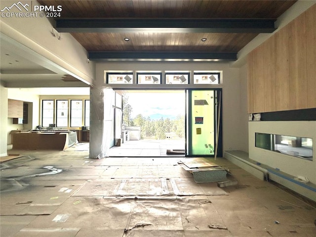 entrance foyer featuring beamed ceiling and wood ceiling