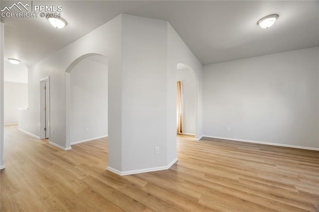 empty room with light hardwood / wood-style floors