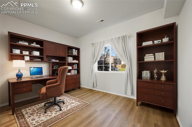 office space with light hardwood / wood-style flooring