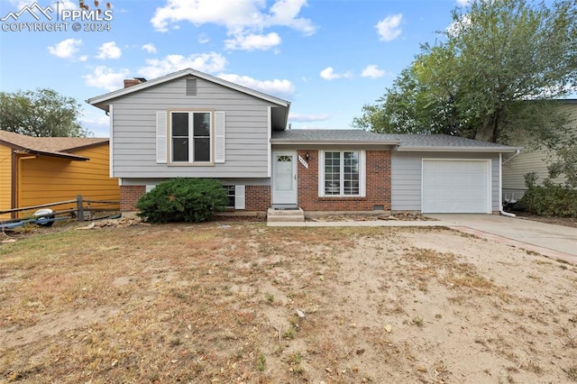 split level home featuring a garage