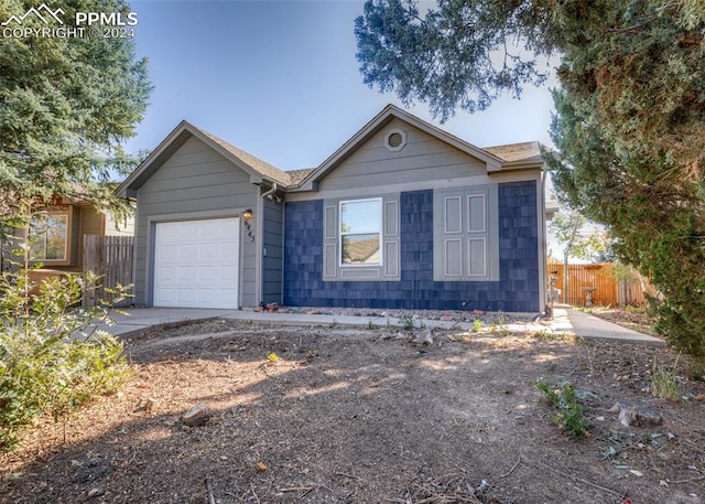 single story home featuring a garage