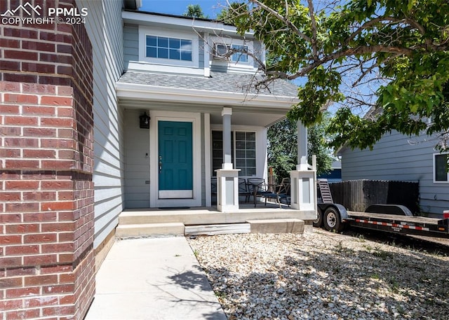 entrance to property featuring a porch