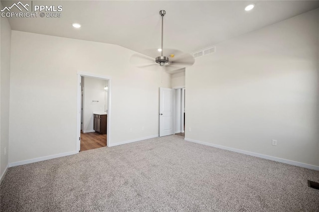 unfurnished bedroom featuring recessed lighting, lofted ceiling, visible vents, carpet flooring, and baseboards