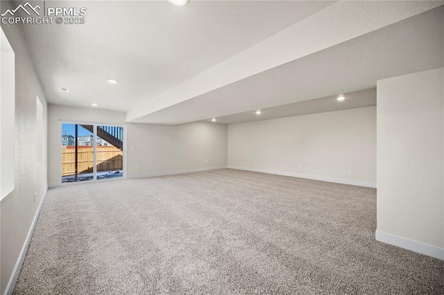 unfurnished room with carpet floors, baseboards, and recessed lighting