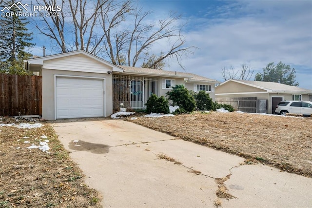 ranch-style home with a garage