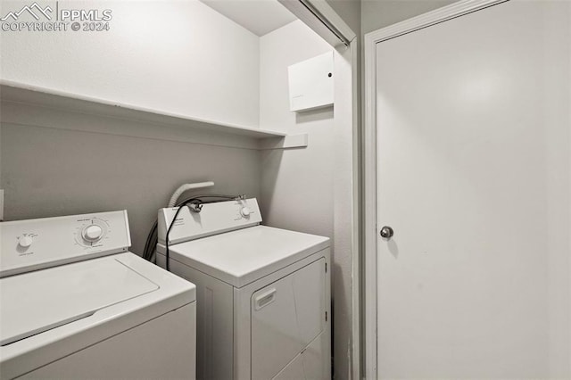 laundry room featuring separate washer and dryer