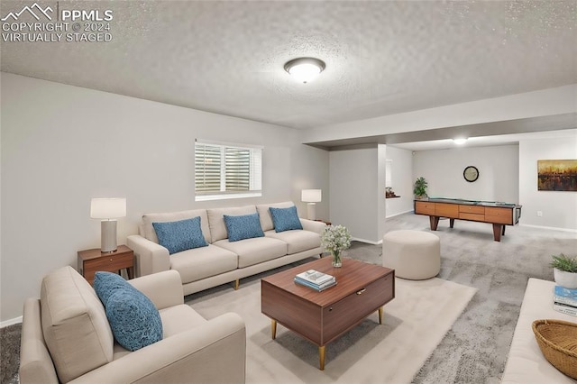 6555 Turkey Tracks Rd, Colorado Springs, CO 80922 - living room featuring a textured ceiling, pool table, baseboards, and carpet floors