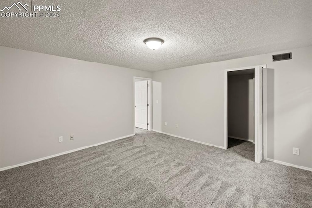 6555 Turkey Tracks Rd, Colorado Springs, CO 80922 - unfurnished bedroom featuring a textured ceiling, carpet, and baseboards