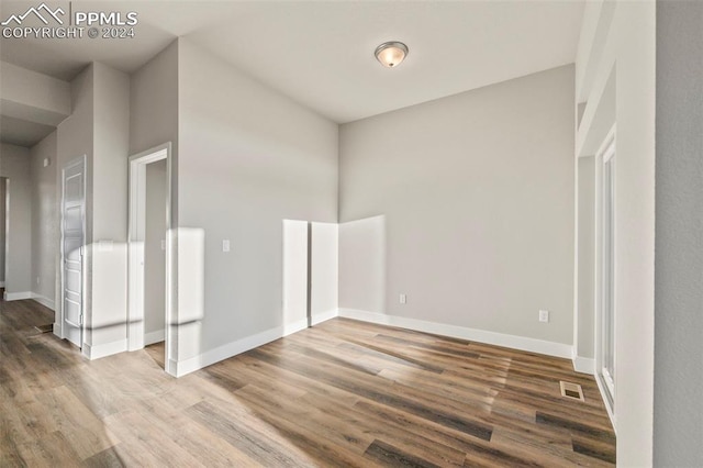 empty room featuring hardwood / wood-style floors