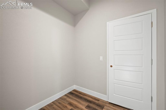 spare room featuring dark wood-type flooring