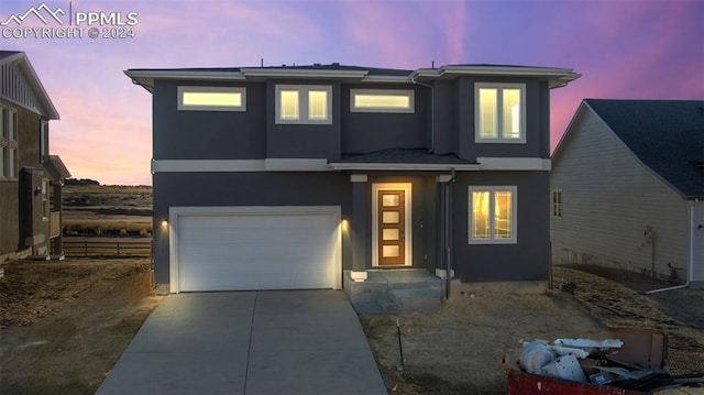 view of front of property with a garage